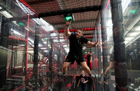 Adult climbing their way through the TAG X arena